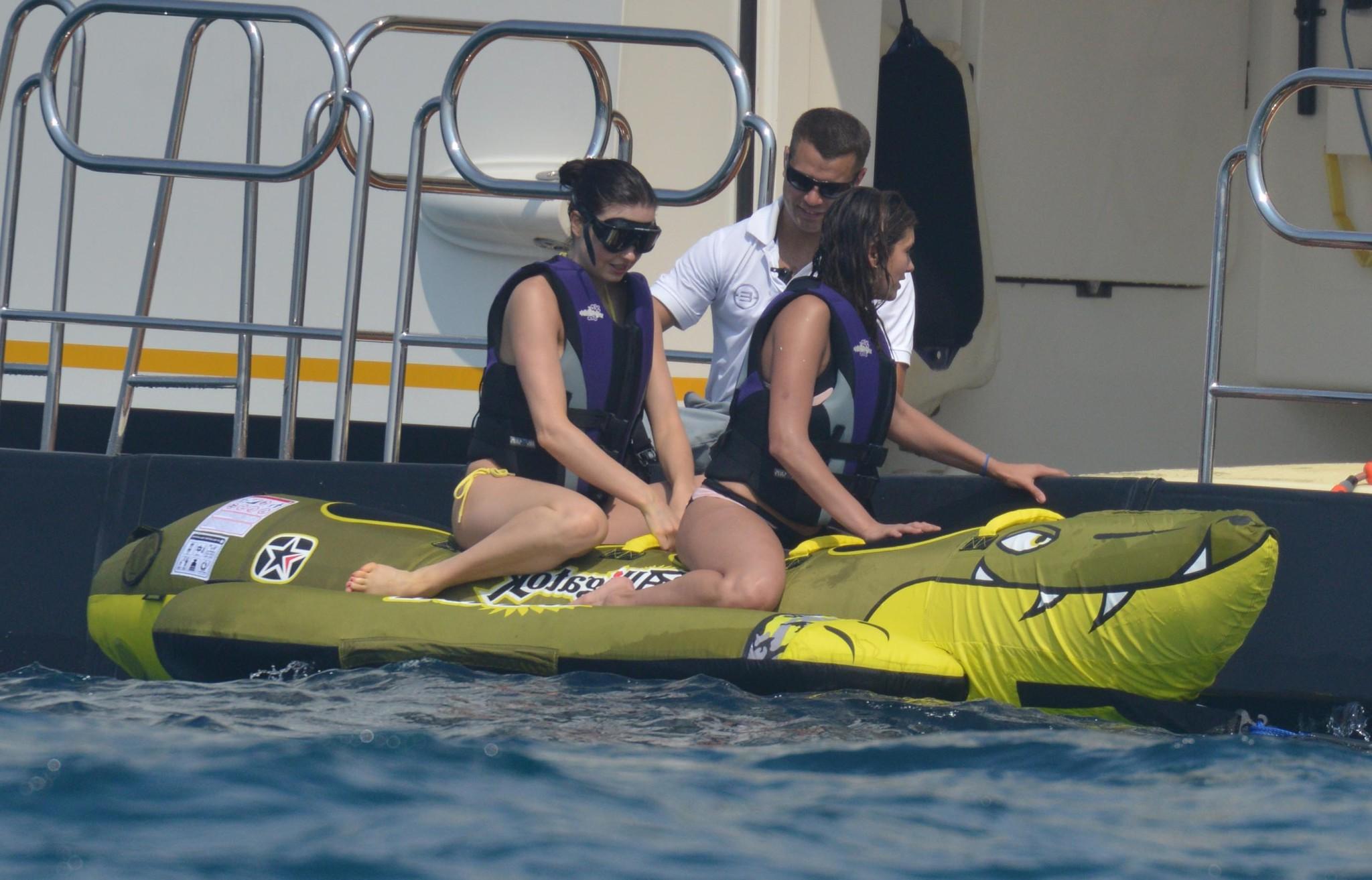 16P Nina Dobrev wearing a flesh colored bikini on a yacht in St Tropez