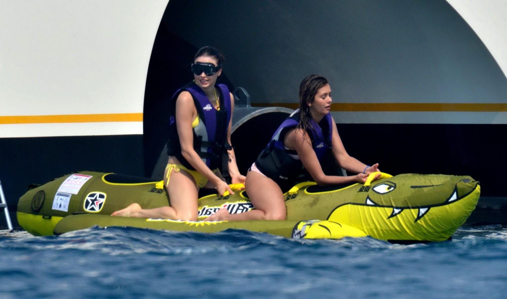 16P Nina Dobrev wearing a flesh colored bikini on a yacht in St Tropez