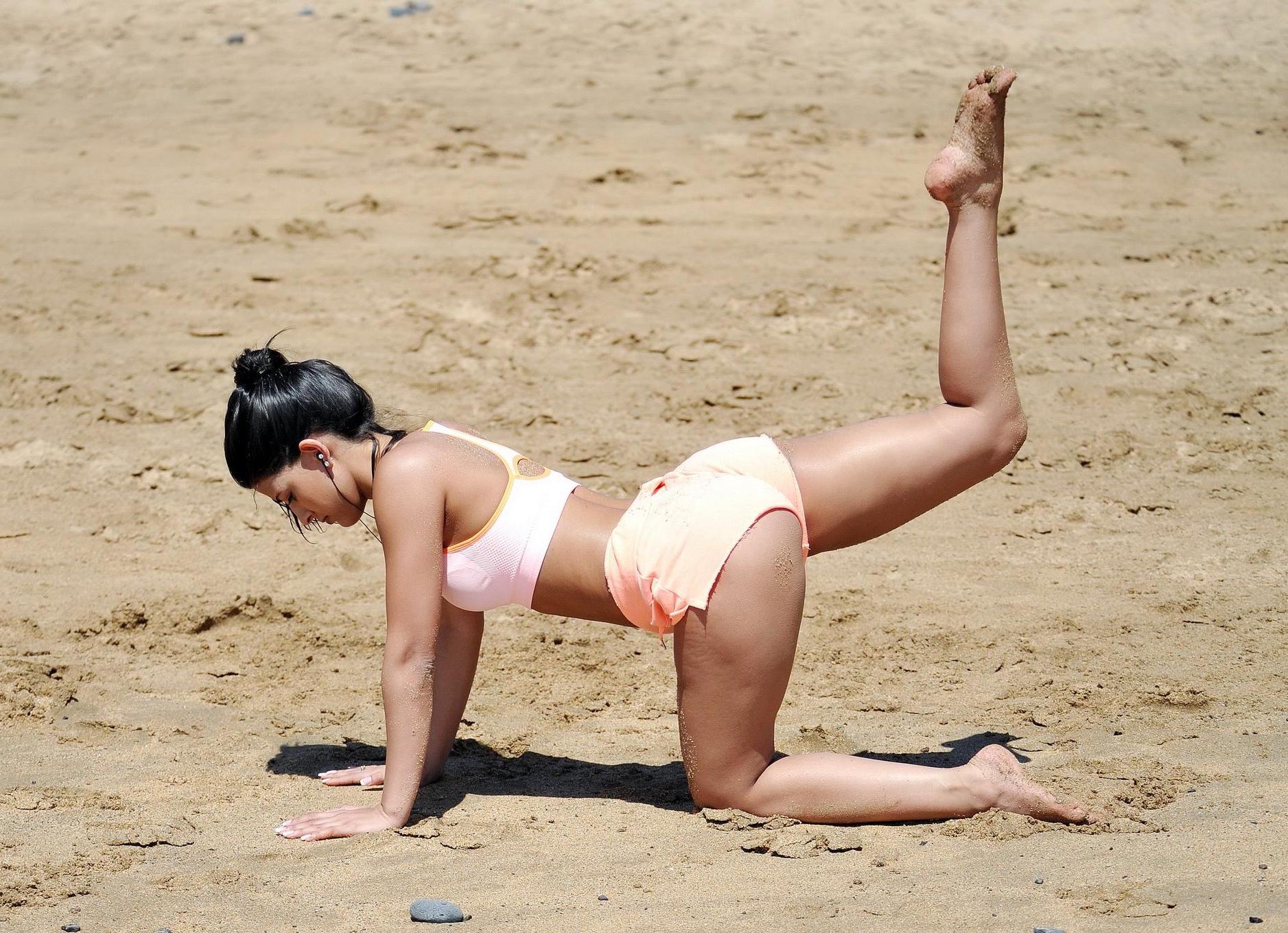 16P Jasmin Walia busty and shows her ass while workout on the beach in Tenerife