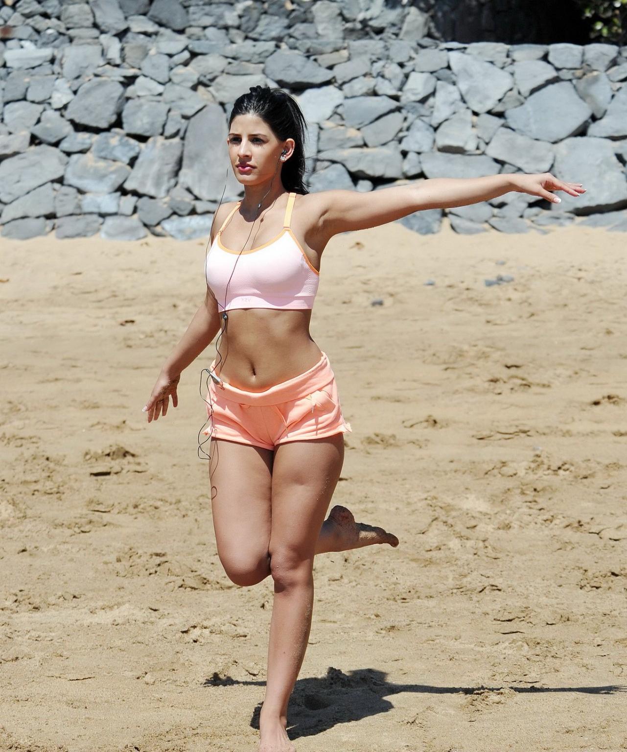 16P Jasmin Walia busty and shows her ass while workout on the beach in Tenerife