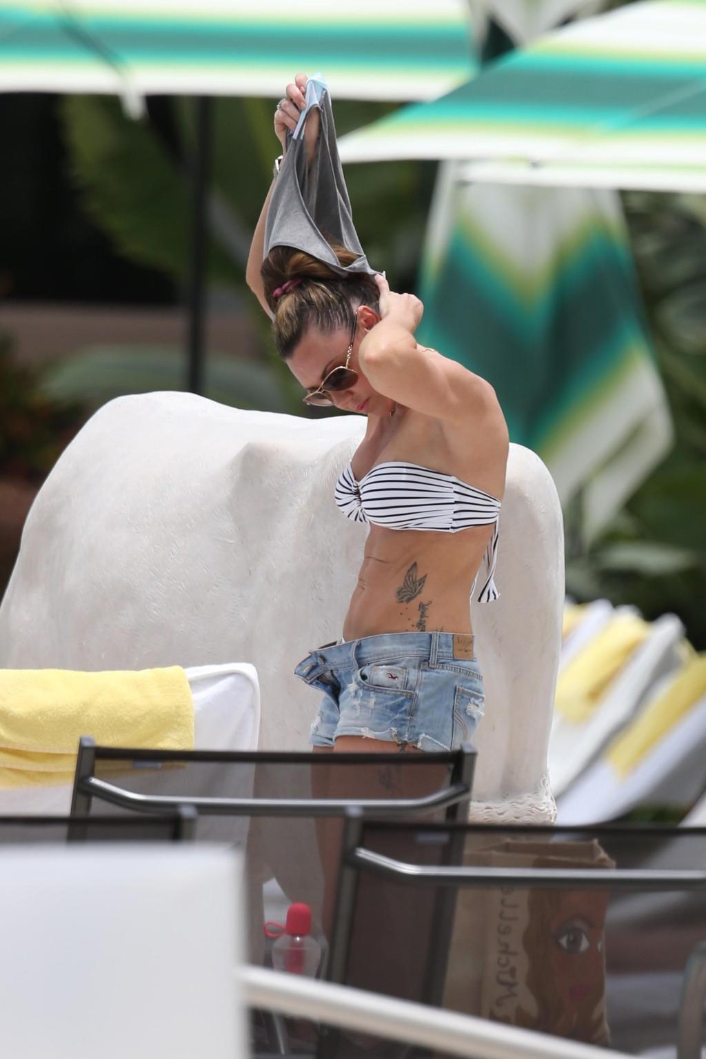 13P Michelle Heaton stripping to bikini on the set of a fitness show on Miami Beach