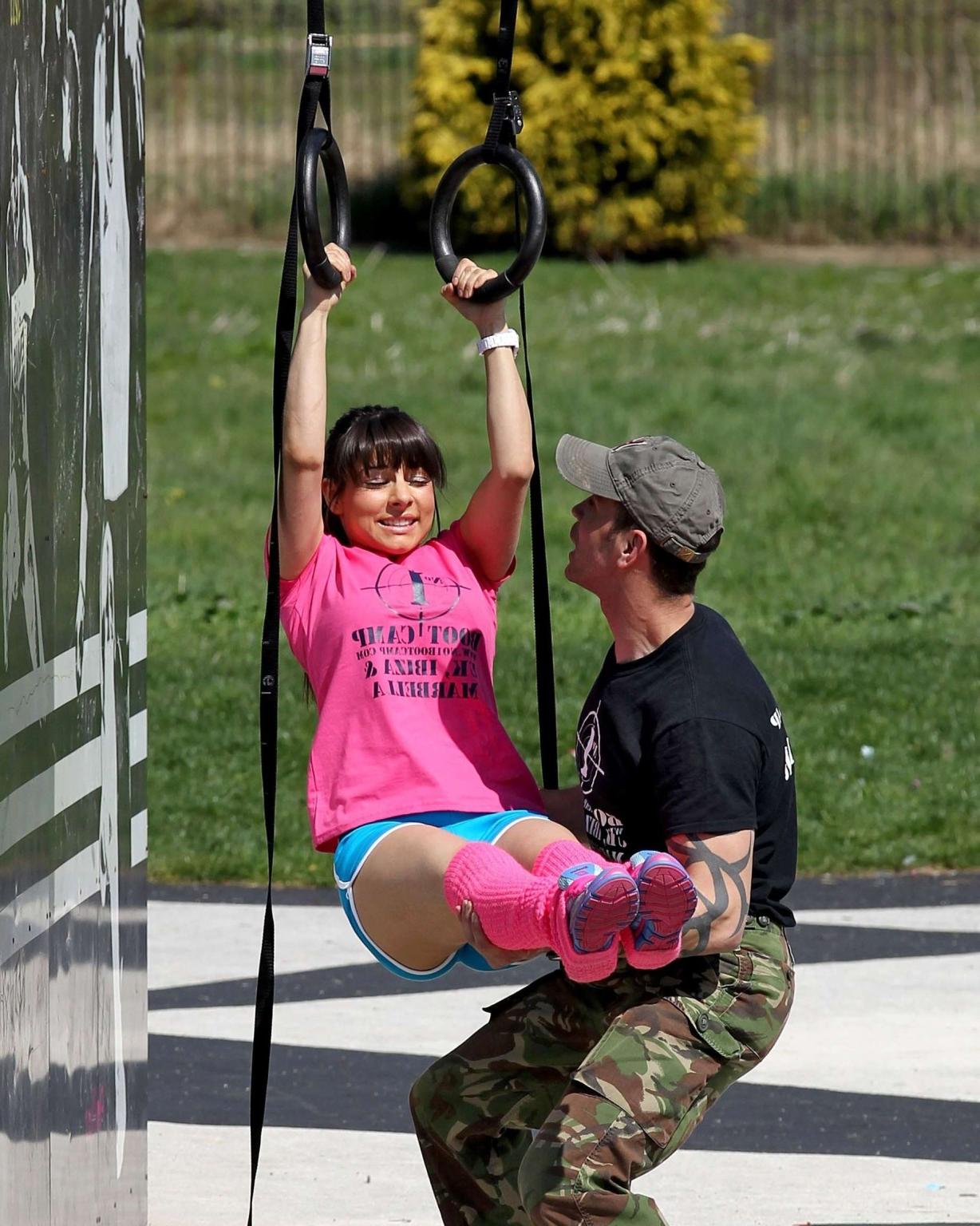 16P Roxanne Pallett shows off her legs  ass in shorts while working out at the outdo