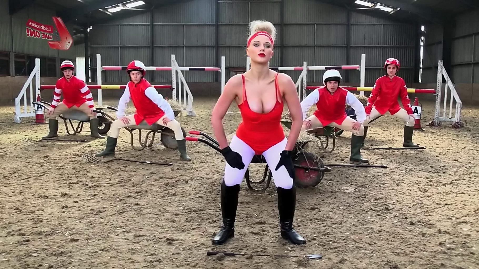 16P Helen Flanagan bursting out of red hot bodysuit at the Cheltenham workout for La