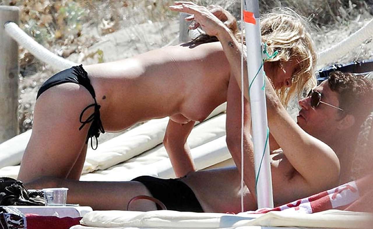 10P Kate Moss showing tits on vacation and flash panties upskirt