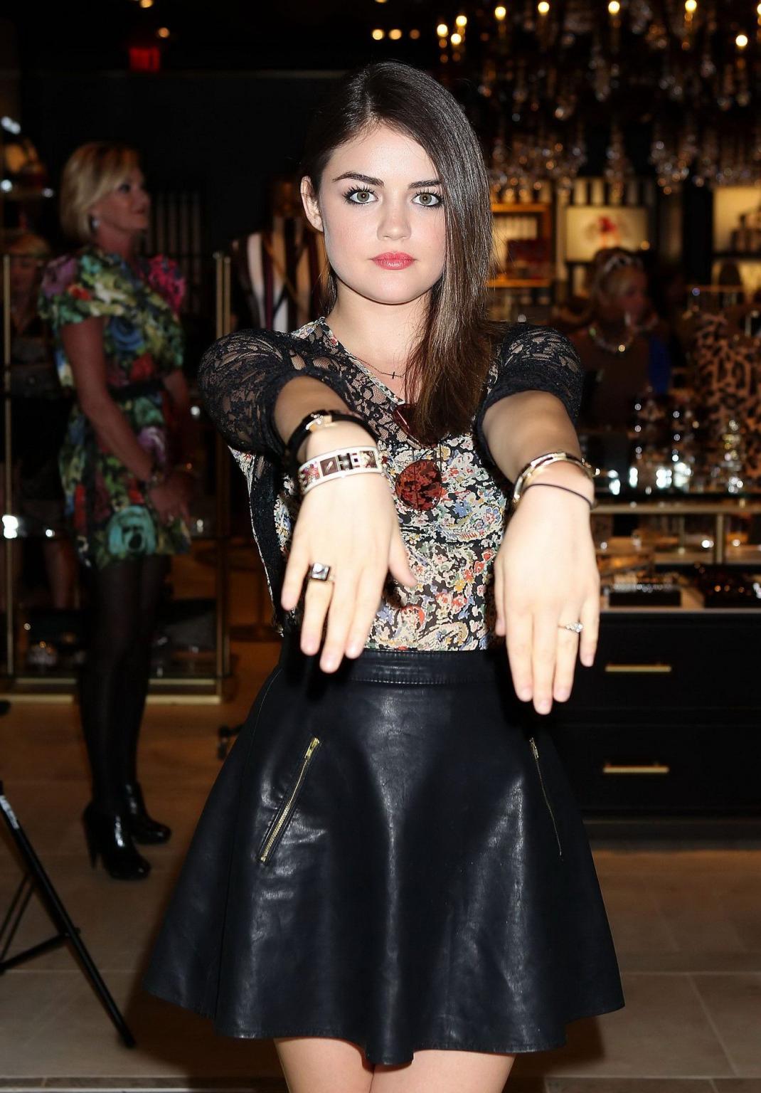 10P Lucy Hale leggy in leather mini skirt opening the Henri Bendel store at Fashion 