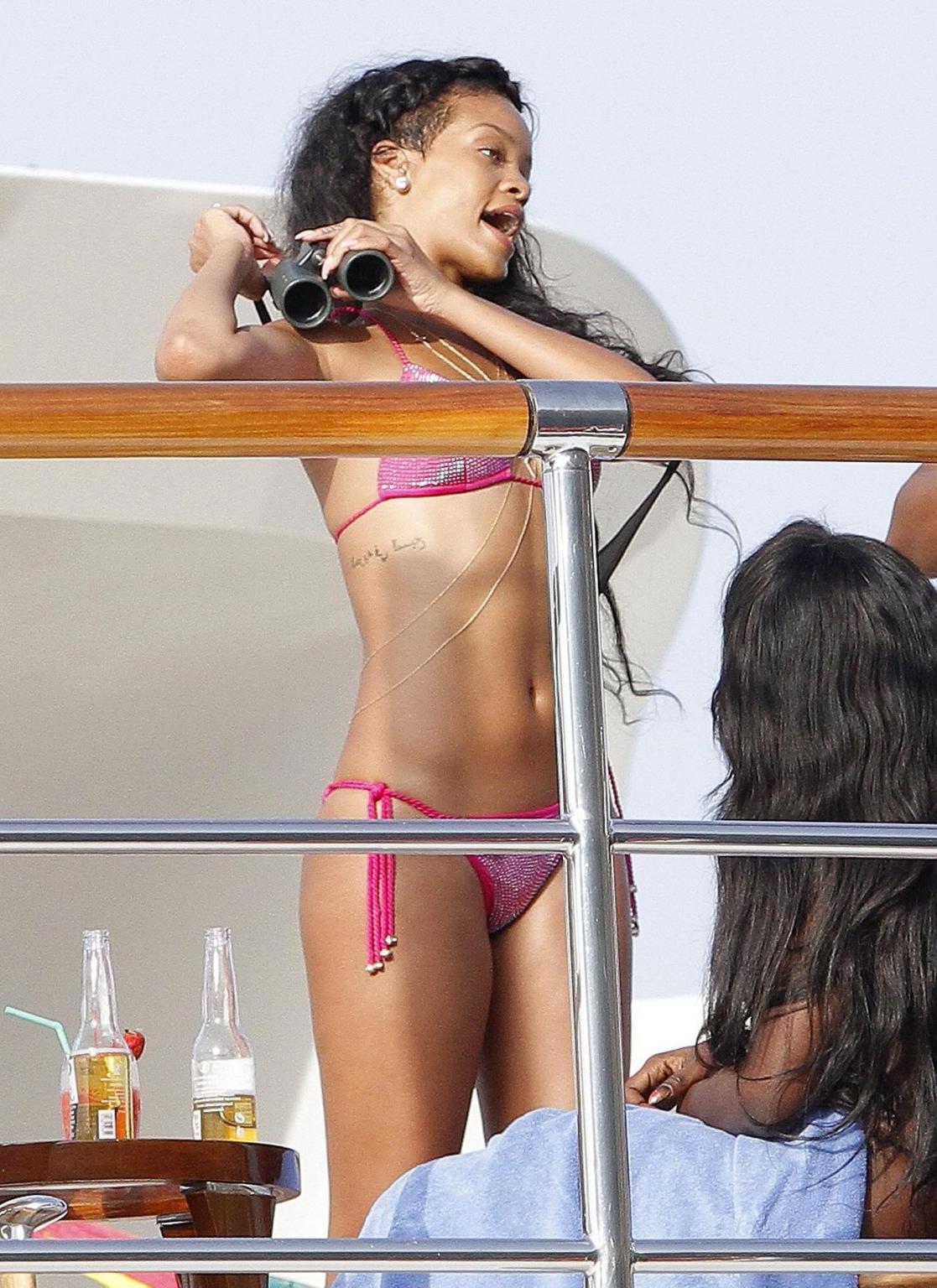 9P Rihanna shows off her ass wearing pink bikini on a yacht in France