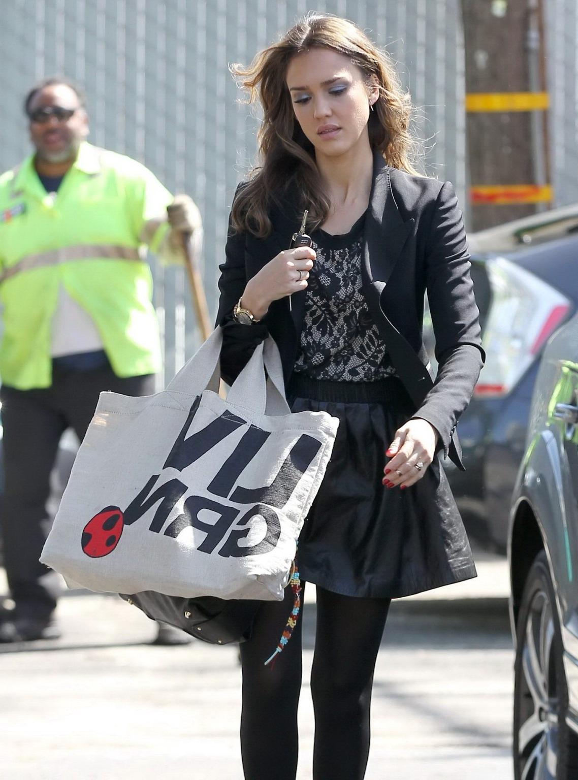 16P Jessica Alba leggy wearing a black leather mini skirt  pantyhose
