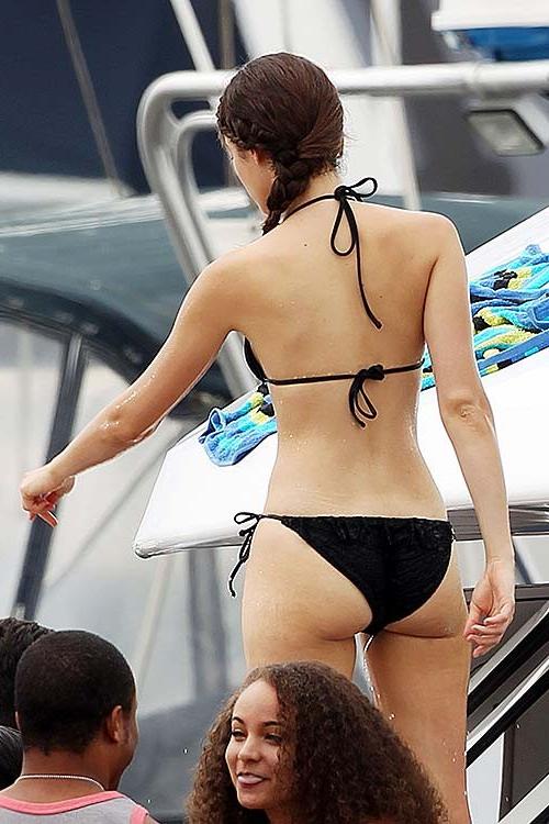 16P Emmy Rossum exposing sexy body and hot ass in black bikini on yacht