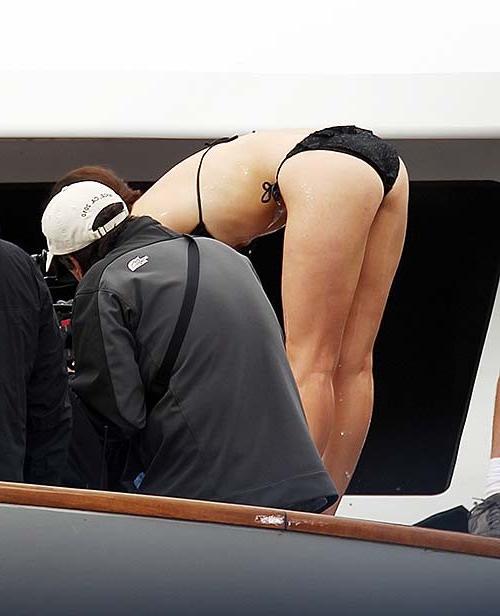 16P Emmy Rossum exposing sexy body and hot ass in black bikini on yacht