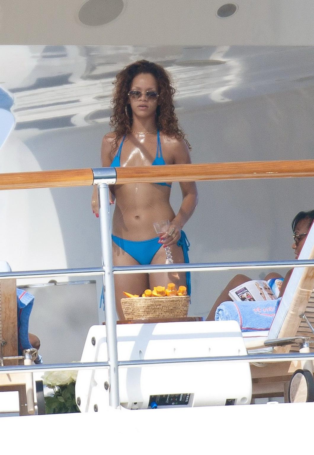 16P Rihanna wearing sky blue bikini on a yacht in Saint-Tropez