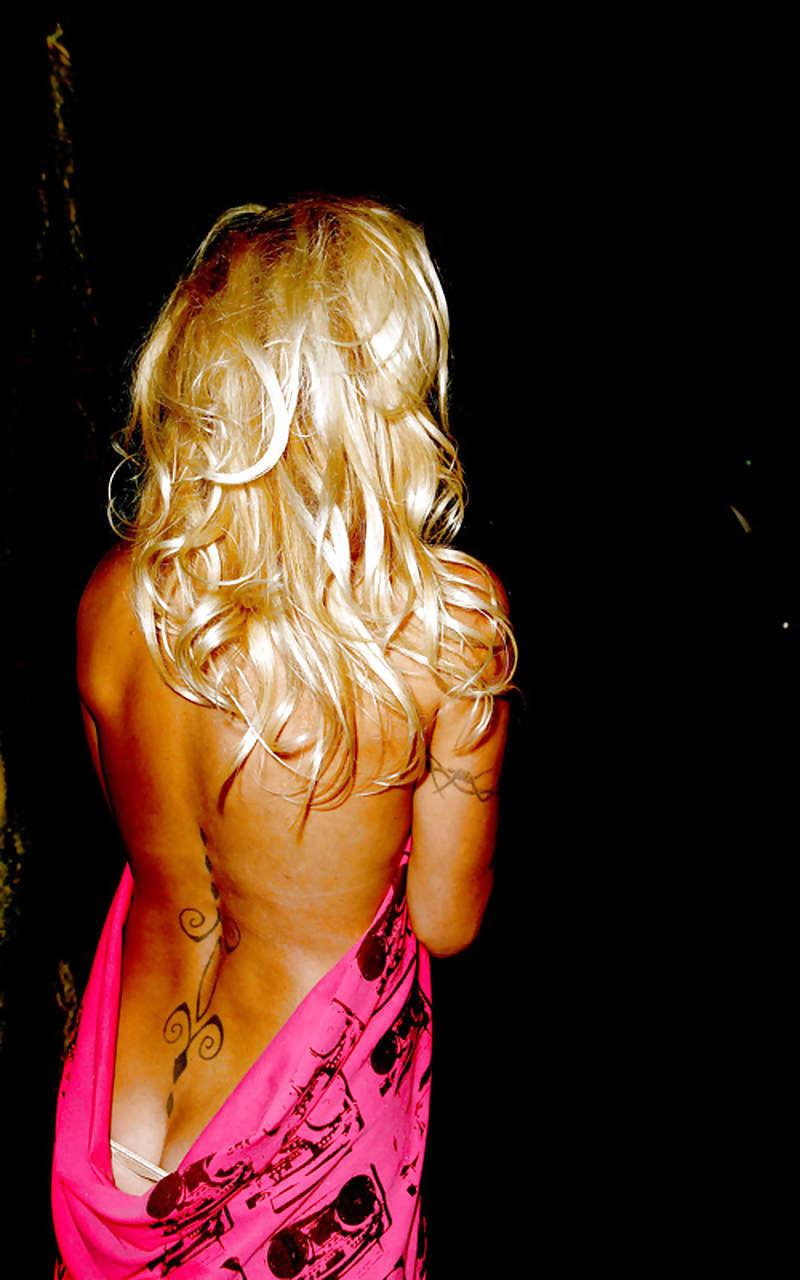 16P Pamela Anderson posing in stockings and showing her big boobs on yacht