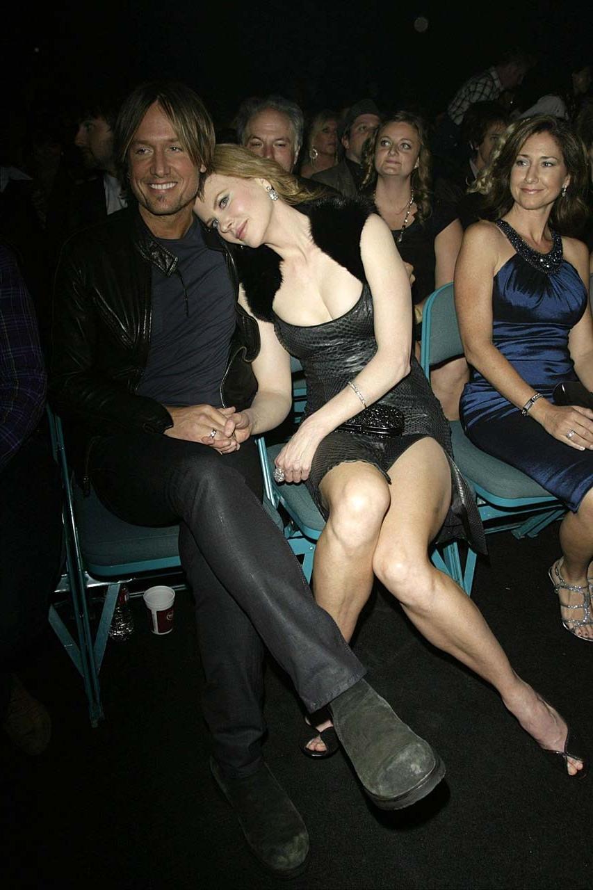 16P Nicole very leggy and sexy in tight low cut leather dress paparazzi pictures