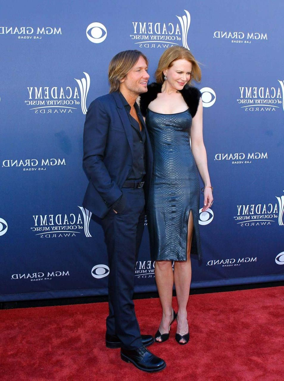 16P Nicole very leggy and sexy in tight low cut leather dress paparazzi pictures