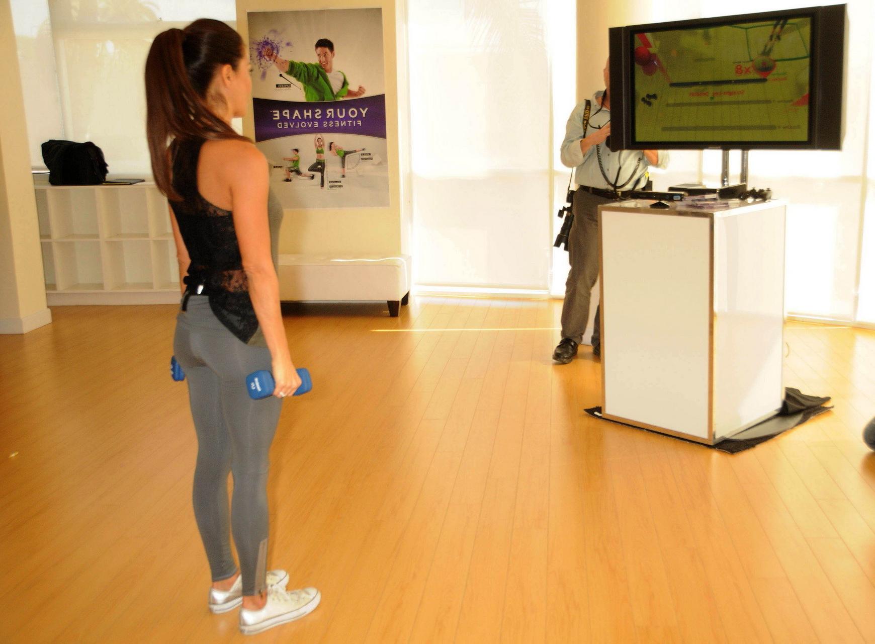 16P Brooke Burke working out in tights  tank-top at Ubisoft's 'Your Shape Fitness Ev