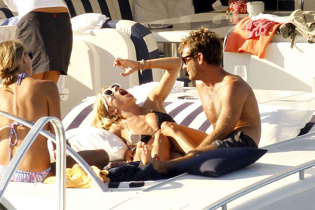 16P Sienna Miller exposing her sexy body and hot ass in black bikini on yacht