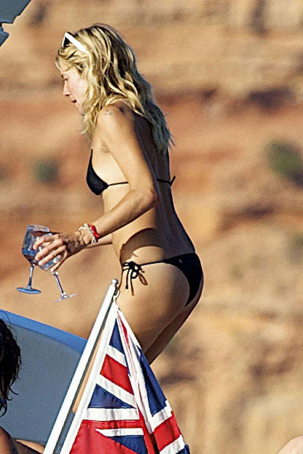 16P Sienna Miller exposing her sexy body and hot ass in black bikini on yacht