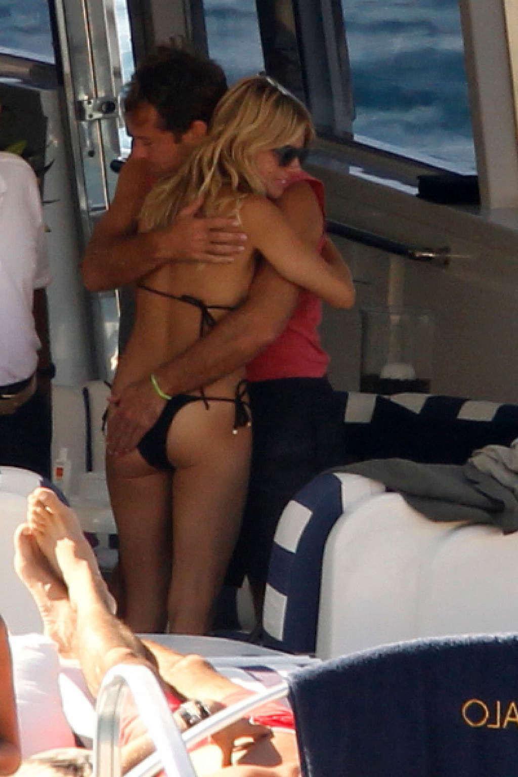 16P Sienna Miller exposing her sexy body and hot ass in black bikini on yacht