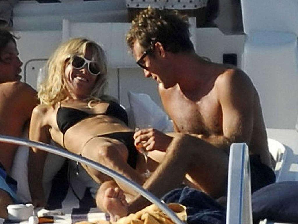 16P Sienna Miller exposing her sexy body and hot ass in black bikini on yacht