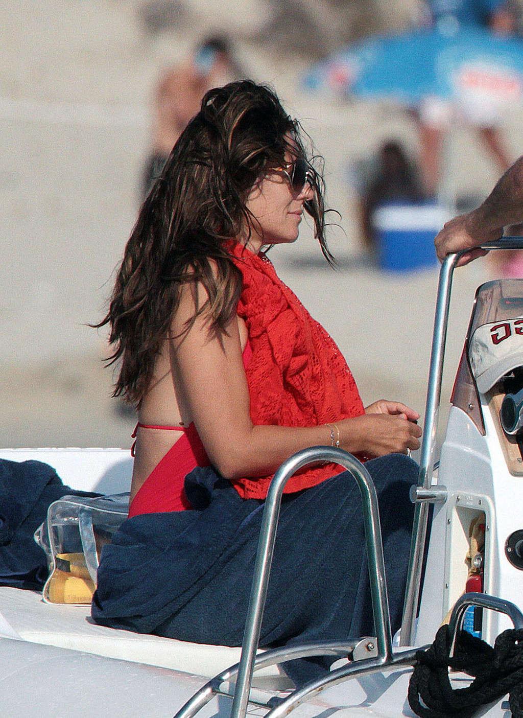 16P Elizabeth Hurley exposing her sexy body and huge boobs in bikini on yacht