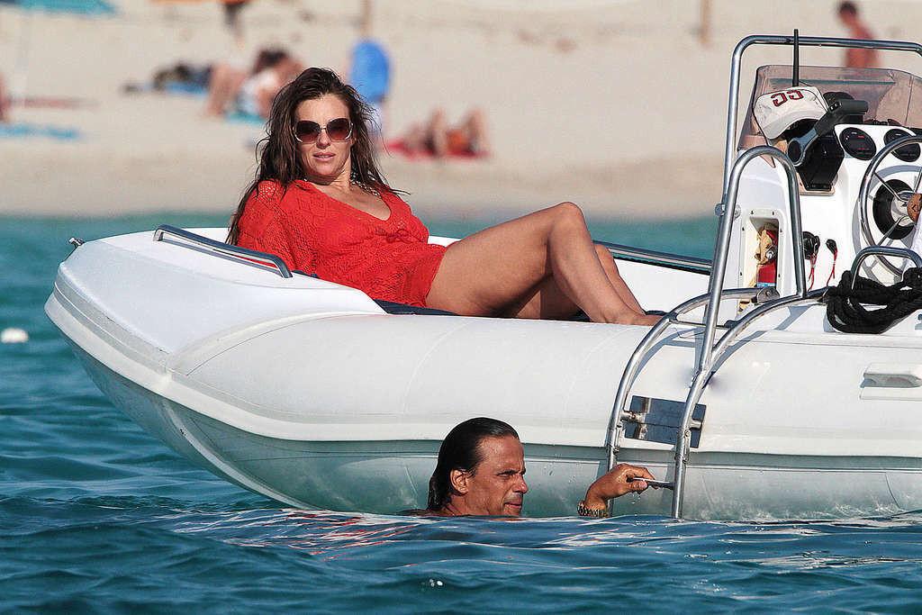 16P Elizabeth Hurley exposing her sexy body and huge boobs in bikini on yacht