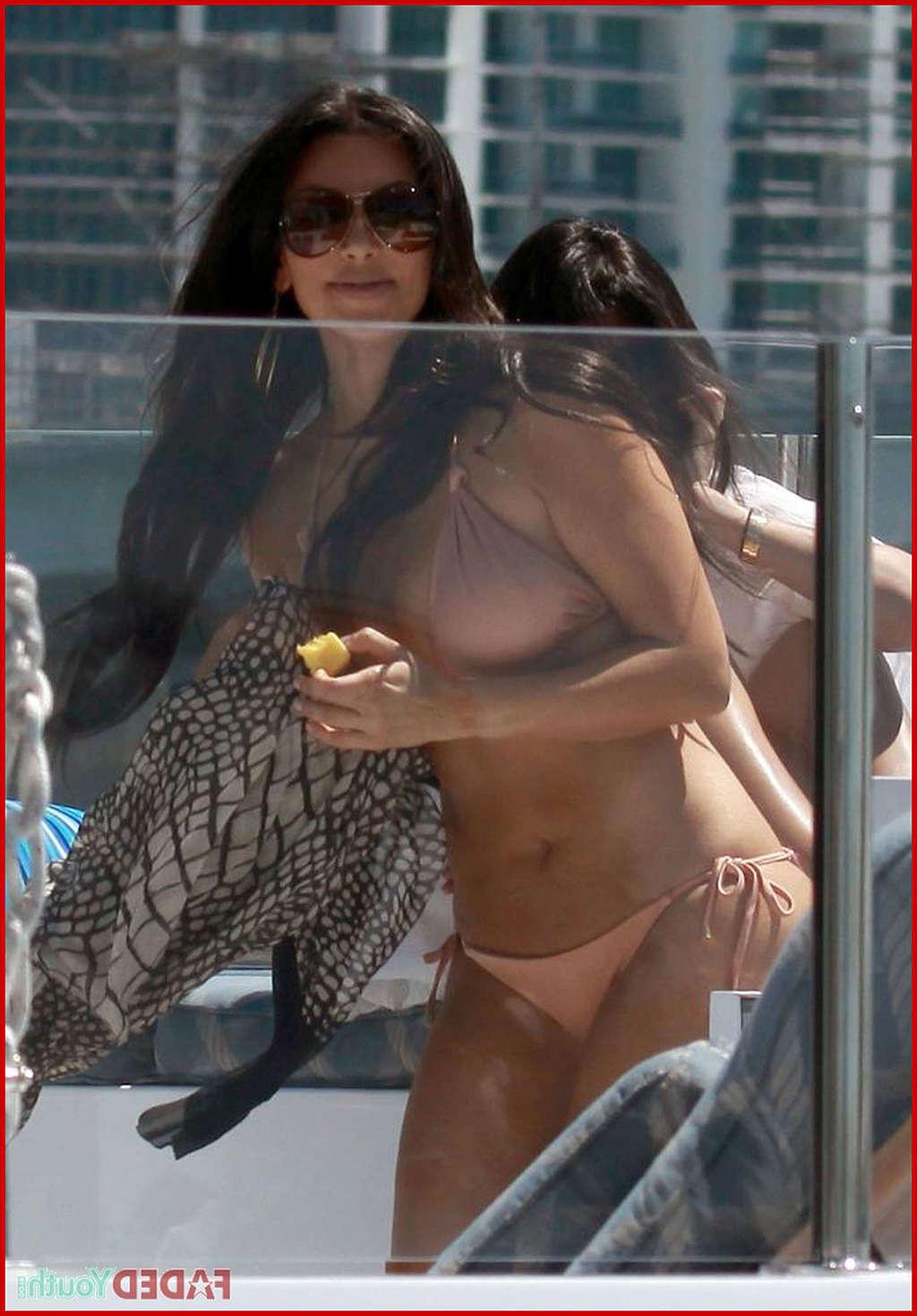 10P Kim Kardashian posing very sexy in bikini on yacht and upskirt and nude
