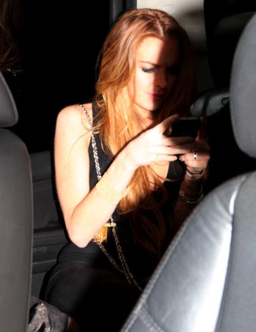 16P Lindsay Lohan showing her ass in see thru pants