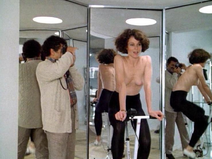 16P Sigourney Weaver shows pert titties and bush