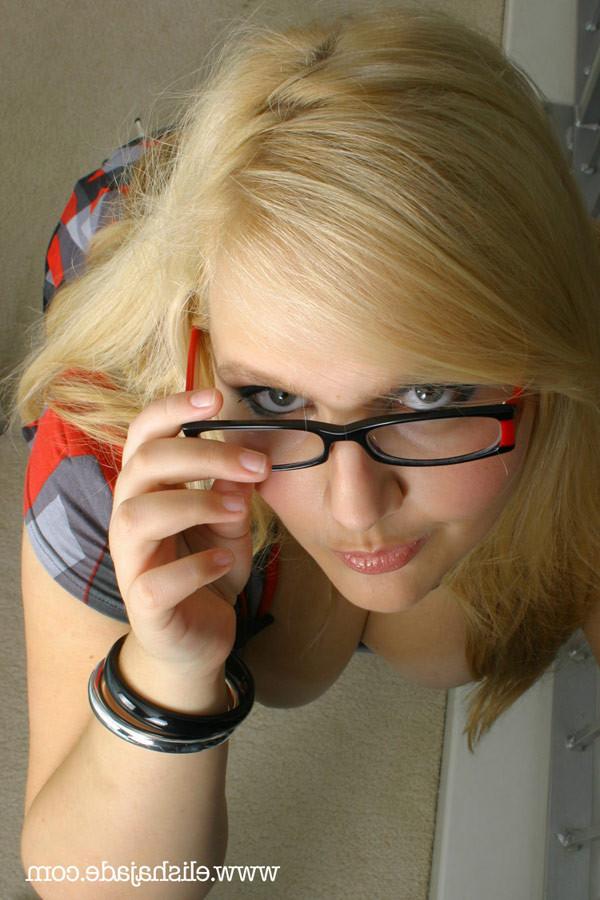 17P Sexy blonde secretary in stockings and glasses stripping