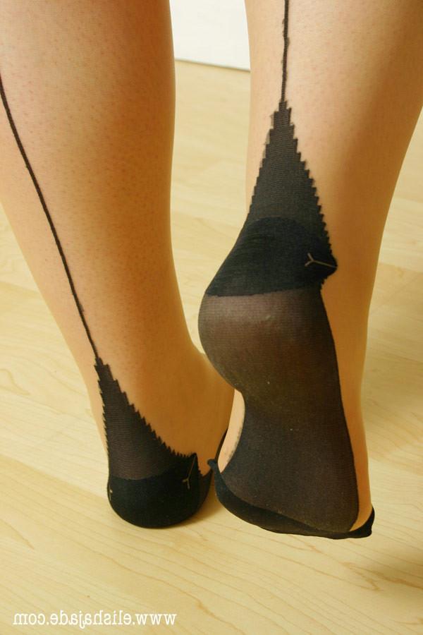 17P Sexy blonde secretary in seamed stockings teasing