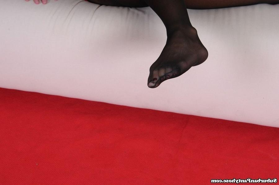 15P Sexy feet and legs of mature woman in encased black pantyhose