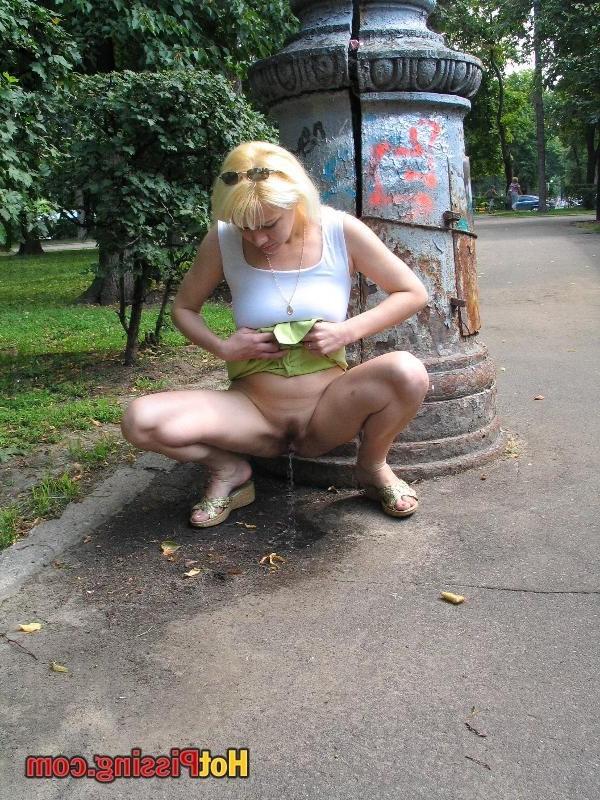 10P Outdoor pissing escapade of a slutress in a white top and a green mini