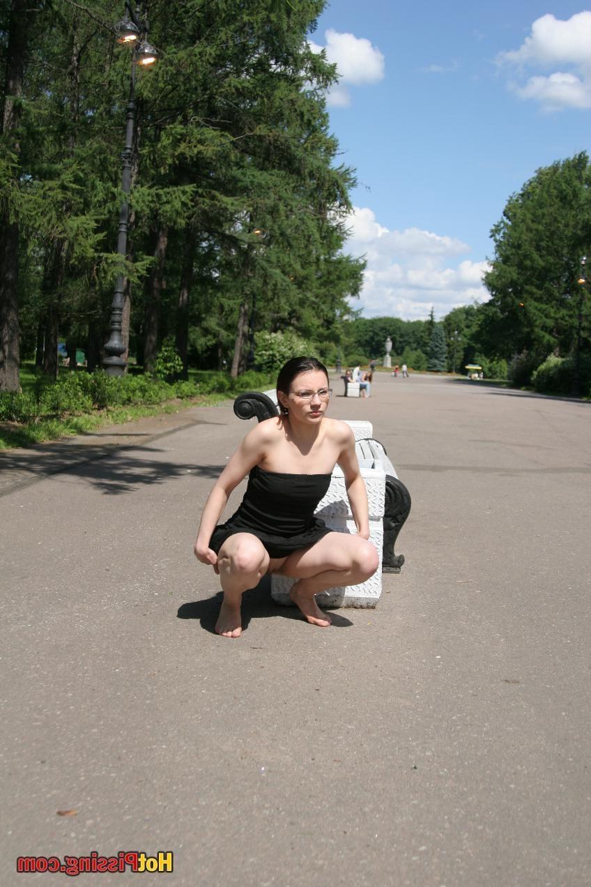 10P Hotsy with bare feet and in glasses makes a show of her peeing pussy