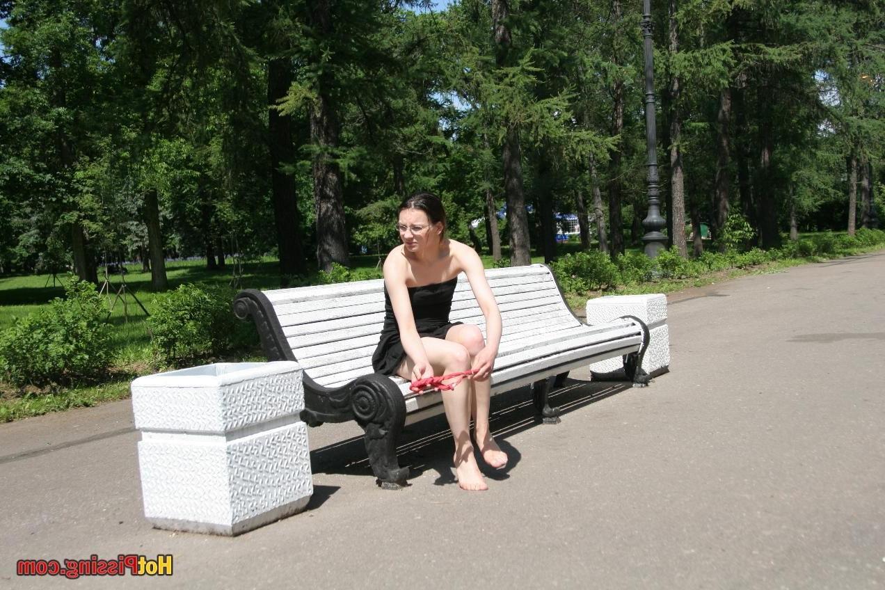 10P Hotsy with bare feet and in glasses makes a show of her peeing pussy