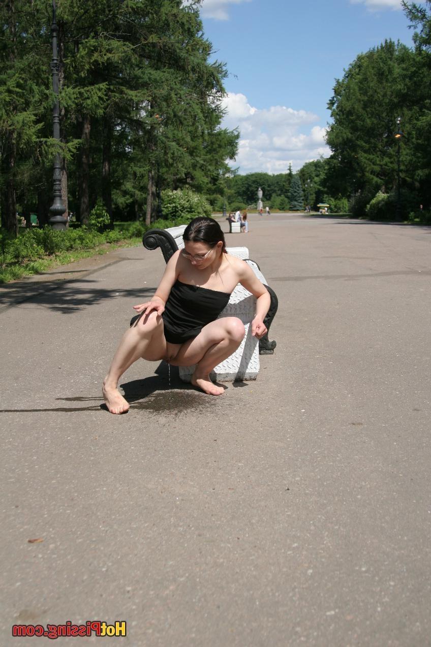 10P Hotsy with bare feet and in glasses makes a show of her peeing pussy