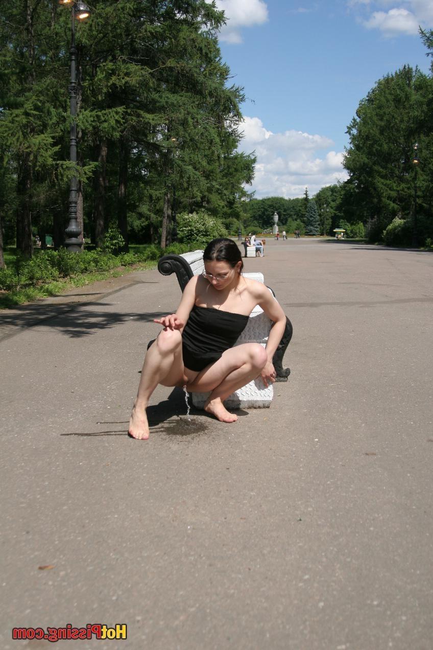 10P Hotsy with bare feet and in glasses makes a show of her peeing pussy