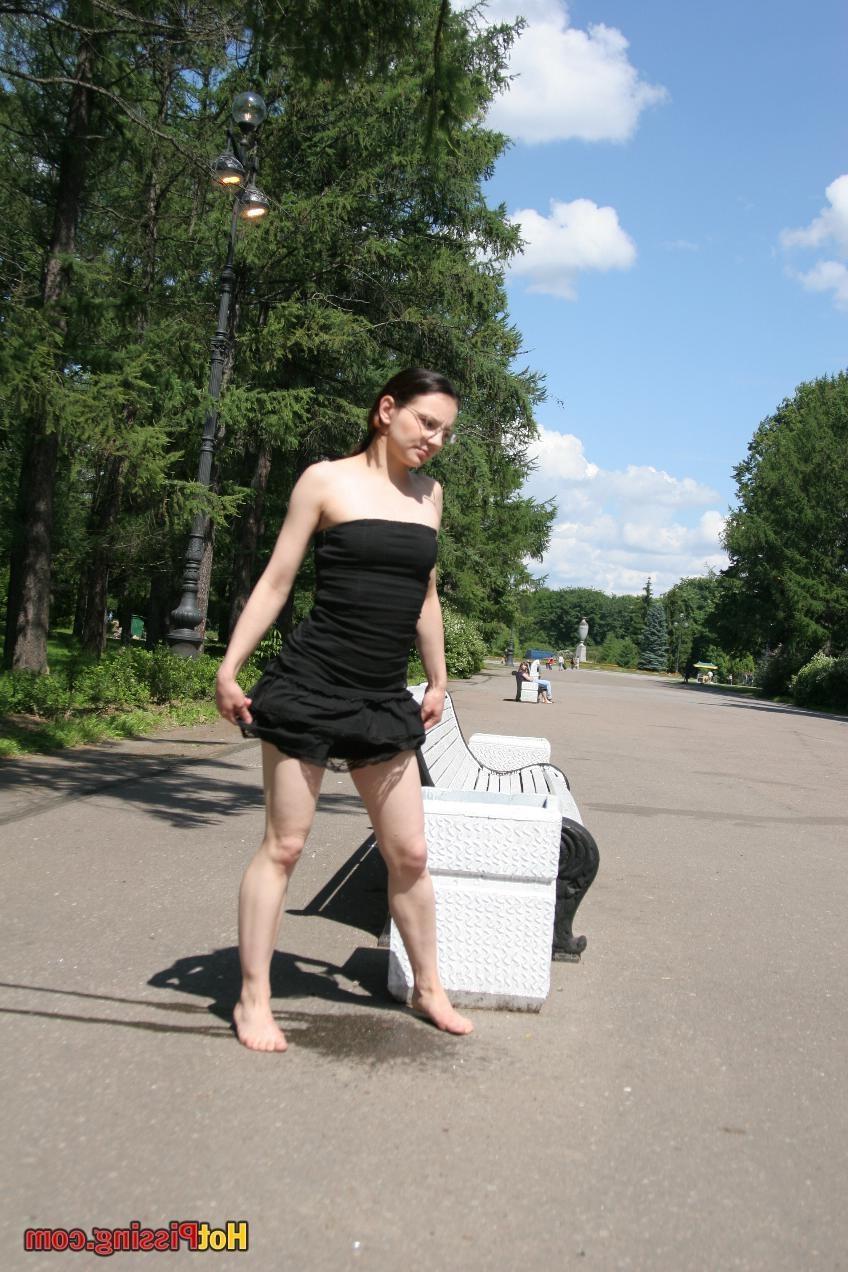 10P Hotsy with bare feet and in glasses makes a show of her peeing pussy