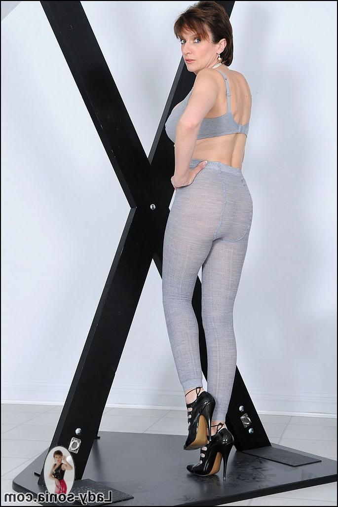 15P Busty mature shows her killer legs in pantyhose