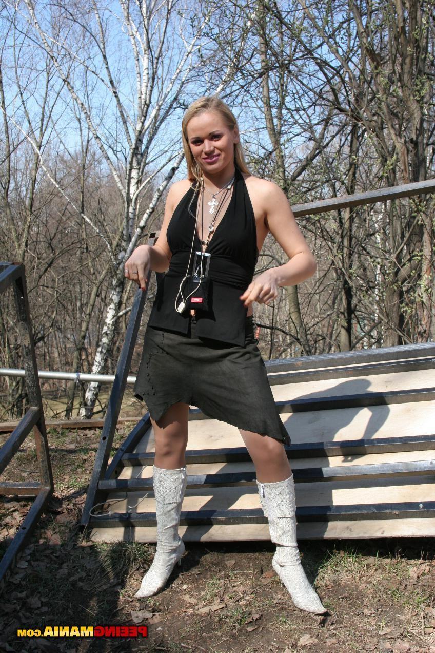 15P Slutty blond in tan stockings makes a pee and wipes her pussy outdoors