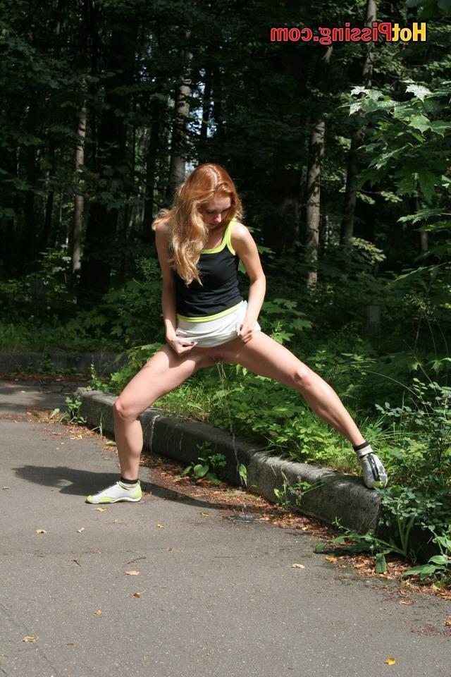 15P Willowy babe demonstrates her skill in flexible pissing in the woods