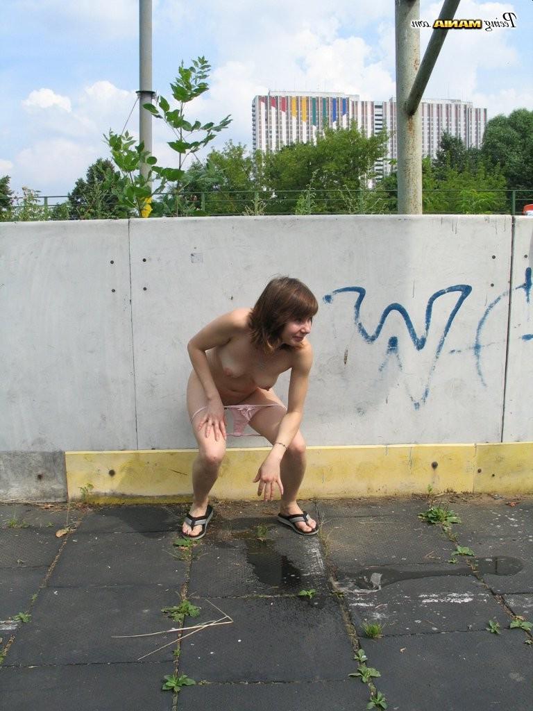 15P Impudent naked chickie does a piss and shows off in a public place
