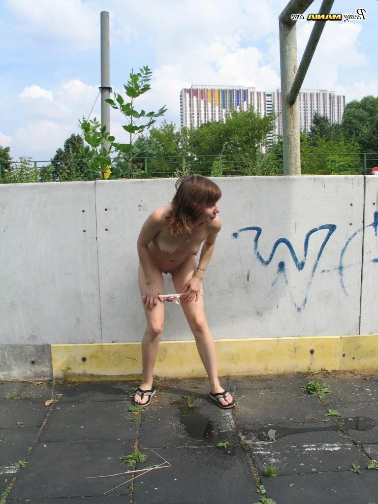 15P Impudent naked chickie does a piss and shows off in a public place