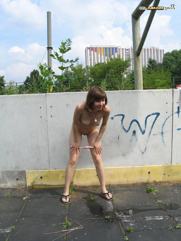 15P Impudent naked chickie does a piss and shows off in a public place