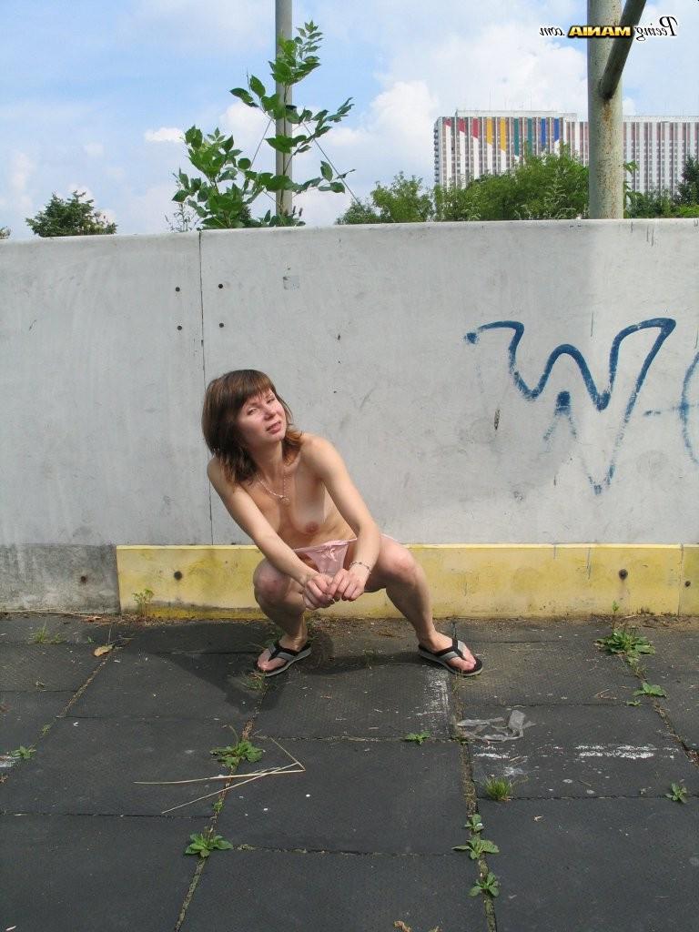 15P Impudent naked chickie does a piss and shows off in a public place