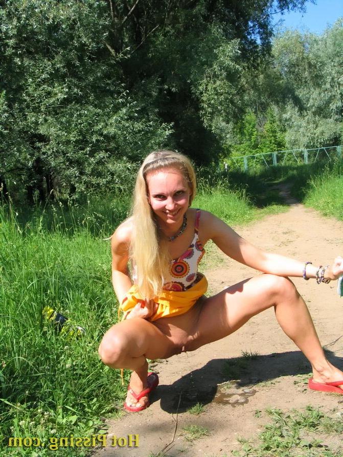 15P Blonde hottie with long hair takes pleasure in doing a pee on the road