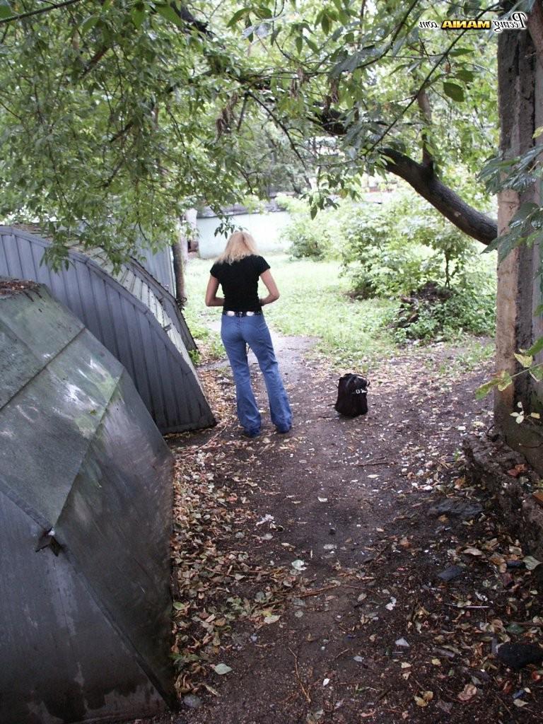 15P From-behind spying on a slender blonde gal in jeans as she does a pee