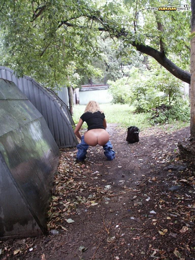 15P From-behind spying on a slender blonde gal in jeans as she does a pee