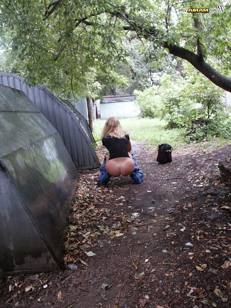 15P From-behind spying on a slender blonde gal in jeans as she does a pee