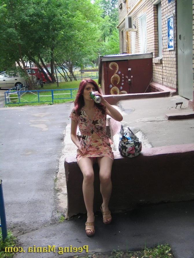 15P Jolly chick drinks in the street and then does a piss there bravely