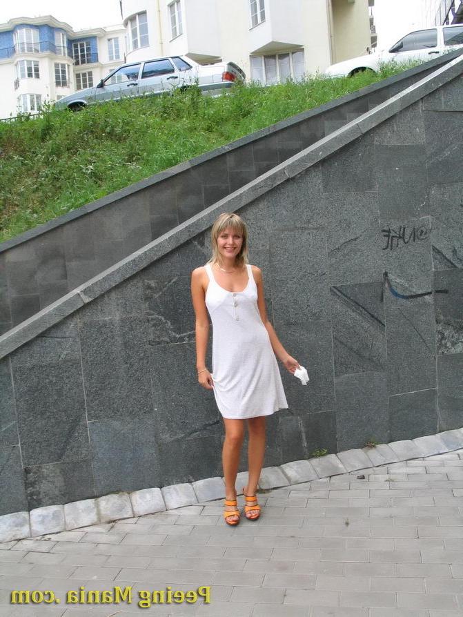 15P Playful blondie has wonderful time making a piss on the stony pavement