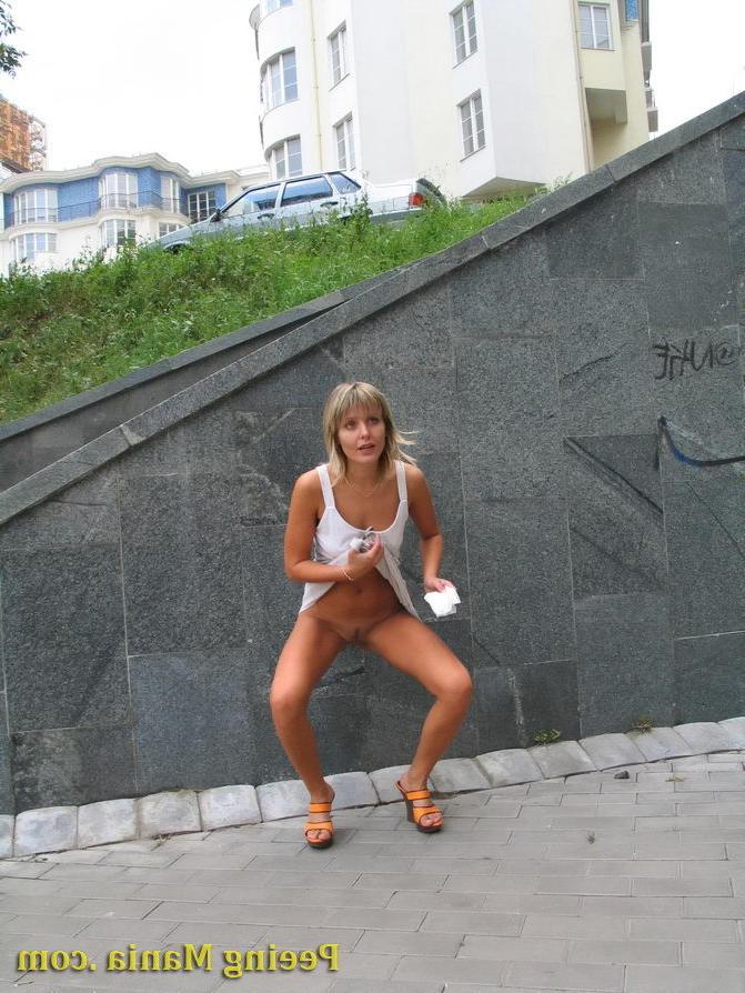 15P Playful blondie has wonderful time making a piss on the stony pavement